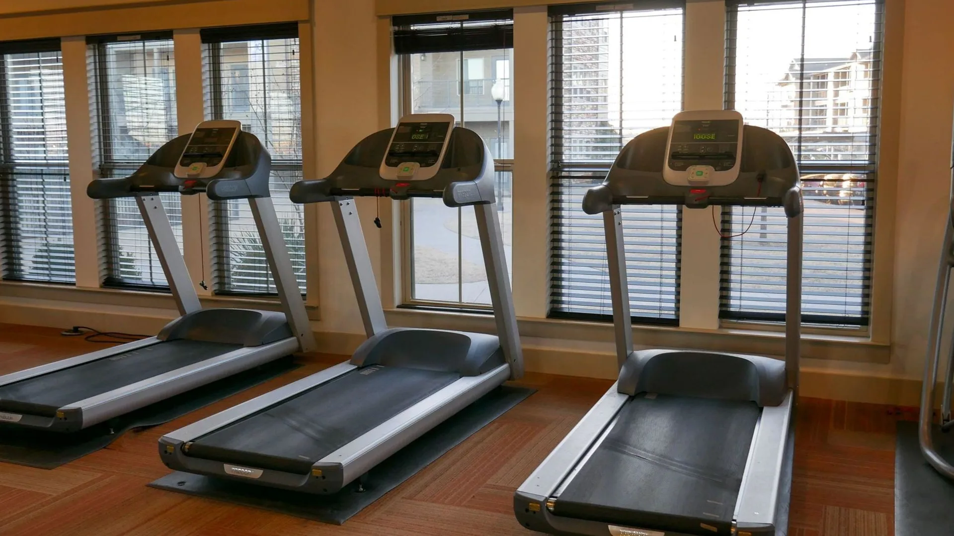 a row of tread machines in a gym at The Anatole on MacArthur North